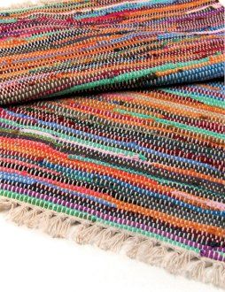 Folded rug view showing the weave’s texture, colours, and hand-finished look.