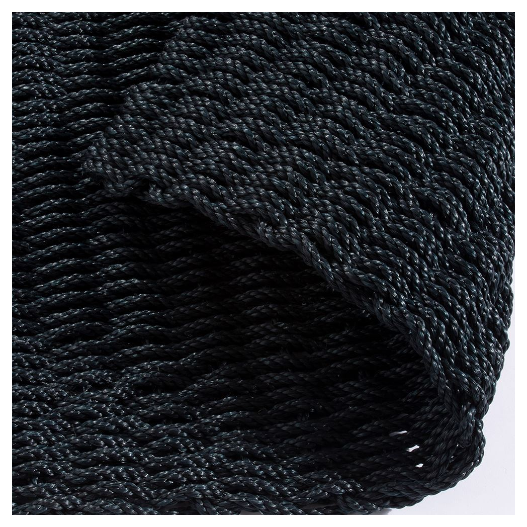 Close-up of navy braided polypropylene doormat showing woven texture.
