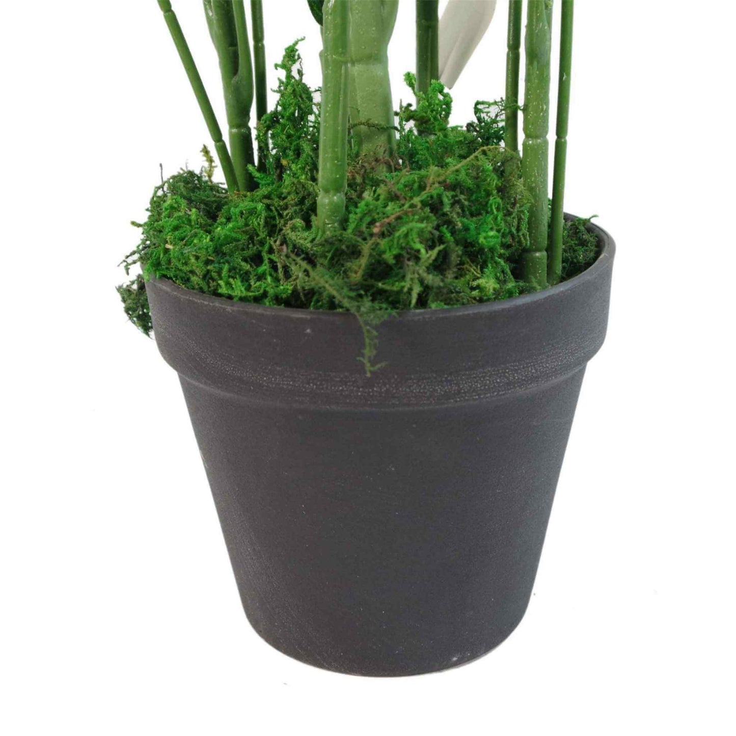 Close-up of artificial bamboo plant base showing green moss detail in a black plastic pot.