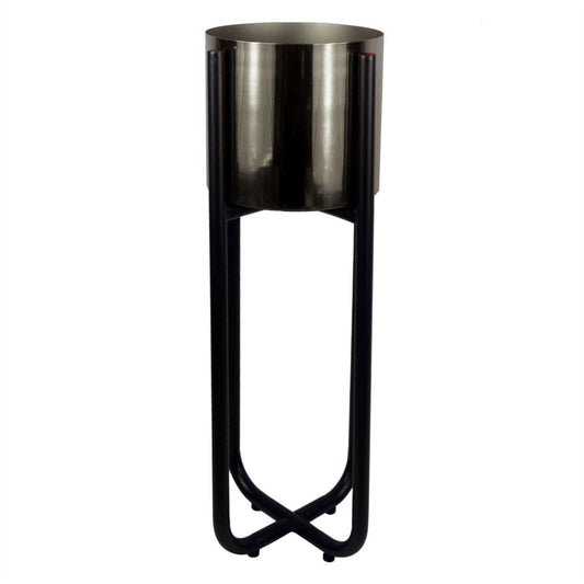  Empty tall black metal plant stand with silver planter insert, 62cm x 18cm, shown close-up to highlight its sleek design and reflective finish.