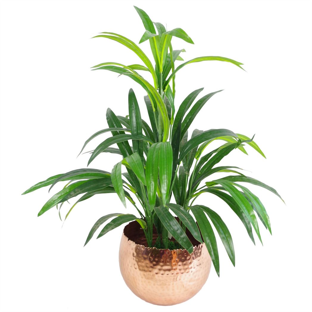 Hammered copper planter styled with a bushy artificial palm.