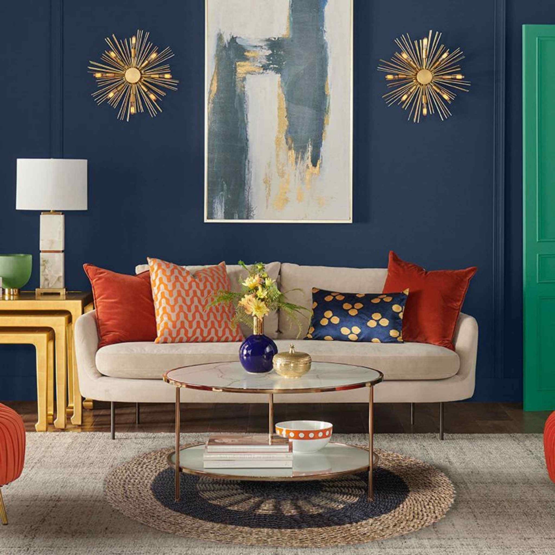 Stylish living room featuring a round seagrass rug with black and tan patterns under a coffee table.