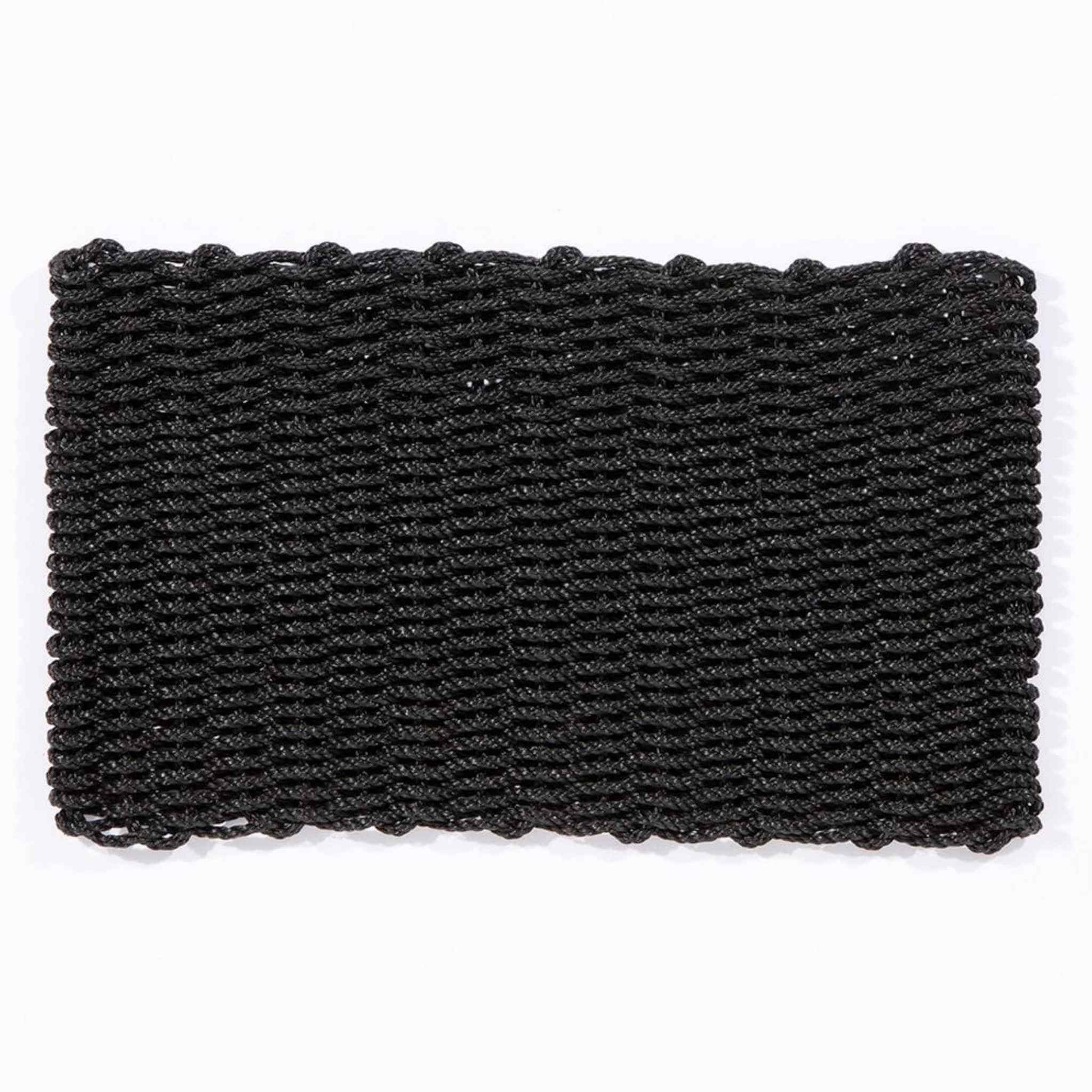 Full view of a rectangular charcoal polypropylene doormat laid flat on a white background.