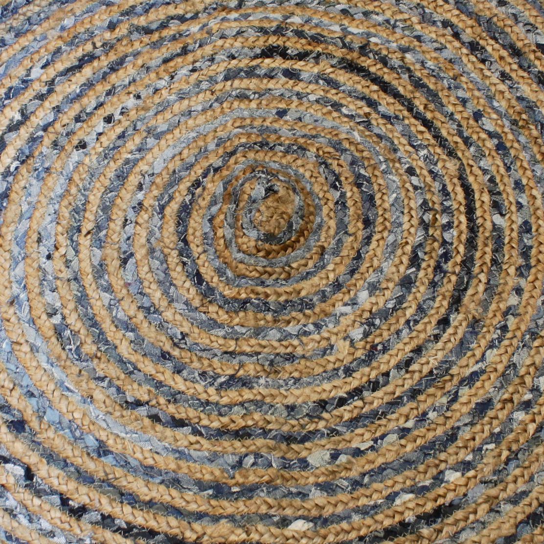 Close-up of a round jute and denim rug showing braided detail and texture.