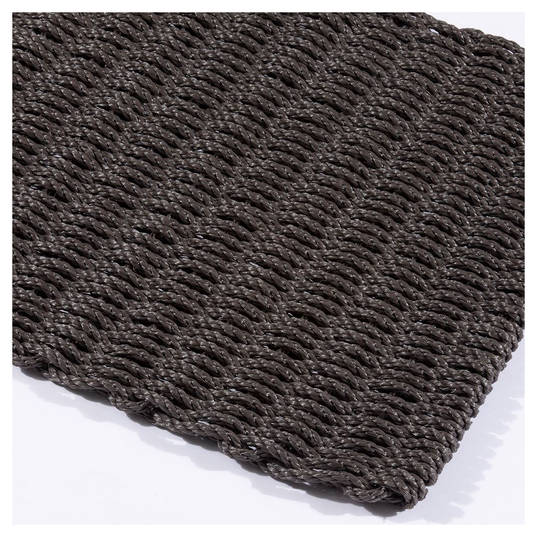 Close-up of slate braided polypropylene doormat showing raised rope weave.