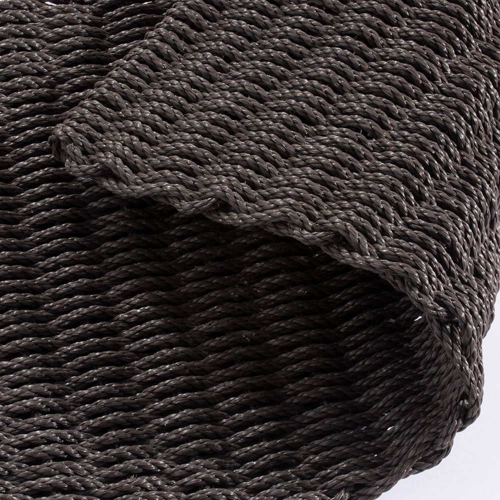 Close-up of slate braided polypropylene doormat showing woven texture.