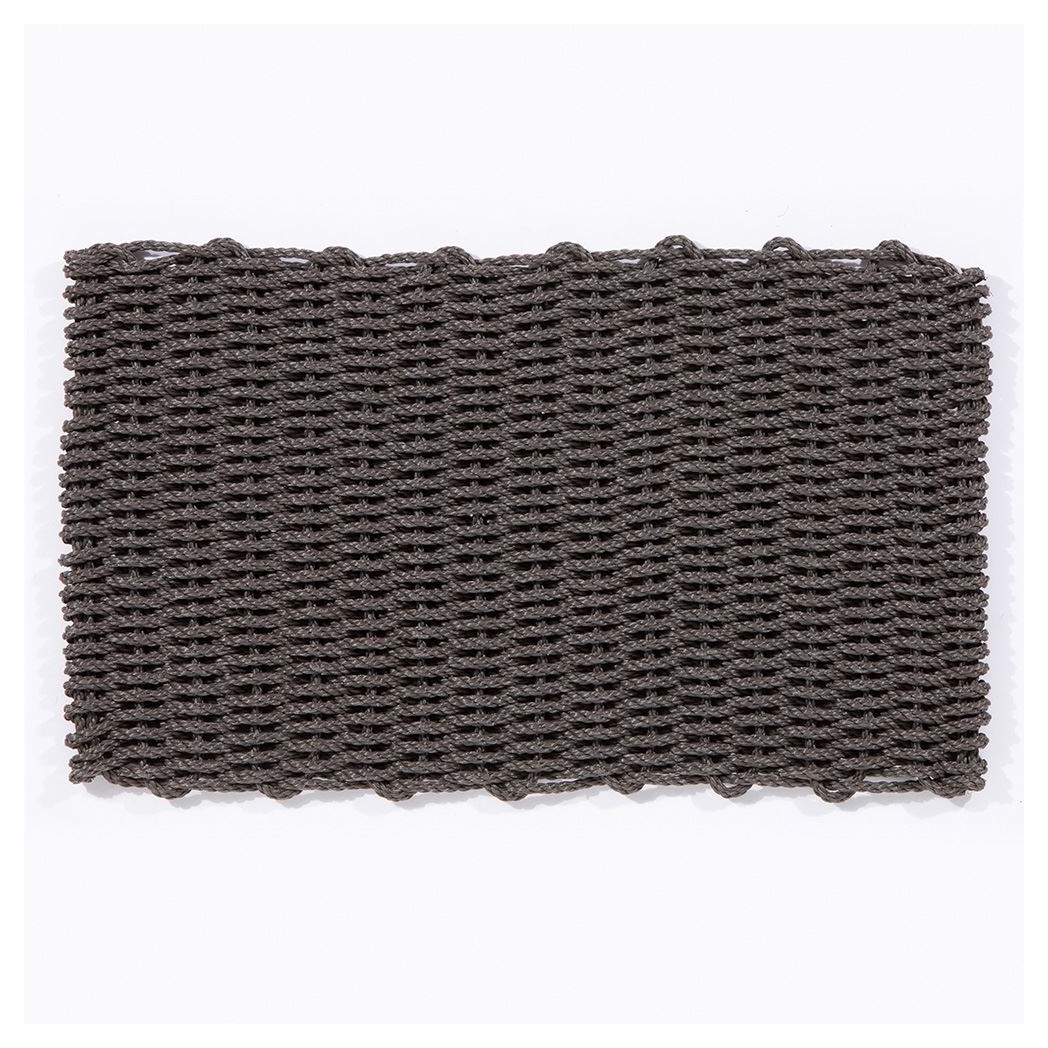 Underside of slate braided doormat showing flat woven base structure.