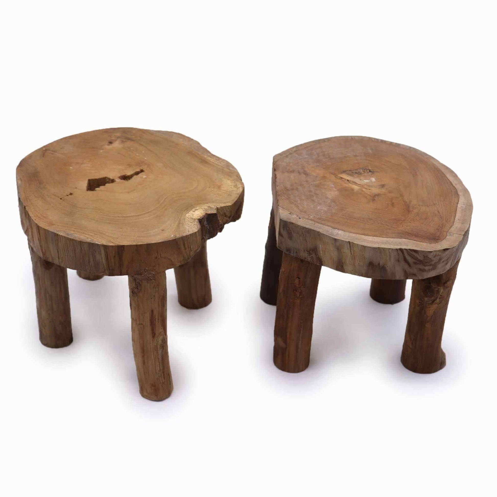 Top view of two solid teak display stands highlighting rich grain details and organic edges.