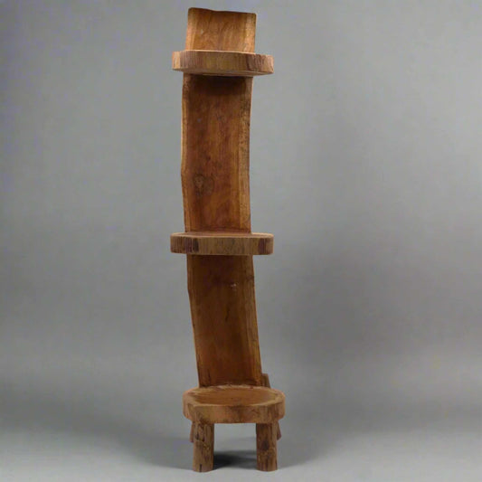 Studio shot of the 100cm teak log three-tier display unit against a neutral background.