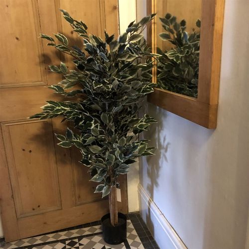 130cm artificial ficus tree with variegated leaves placed in a hallway corner near a mirror and wooden door.